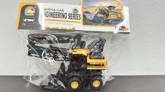 899-69               Бульдозер в пакете. Размер: 13х7х9см.